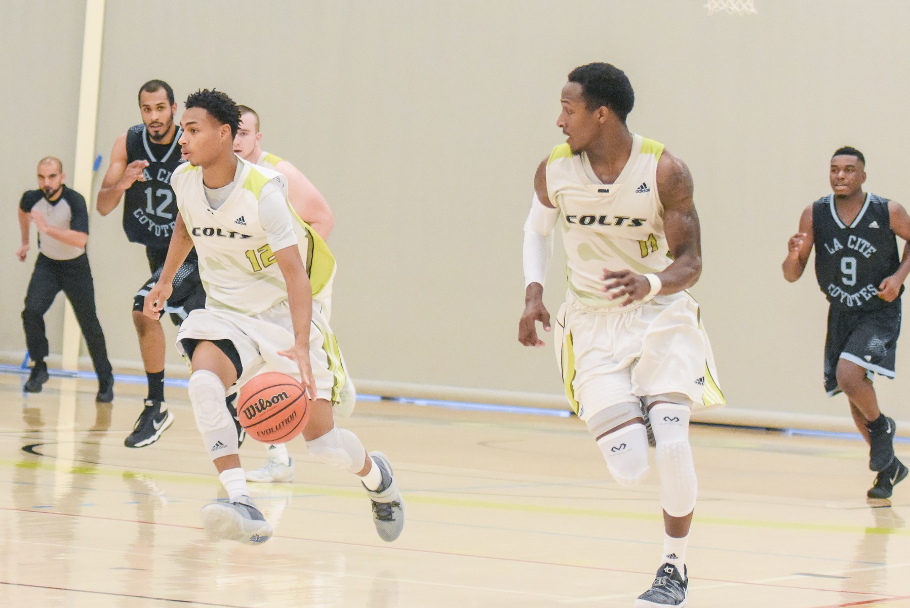 Centennial Colts guard Kendall Wilson runs the fast break while forward Alastair Cole runs back for support against the La Cite Coyotes. Despite blowing a 16 point lead, the Colts hung on, beating the Coyotes, 96-93, at Athletic and Wellness Centre. (Khree Fearman/ Colts Athletics)