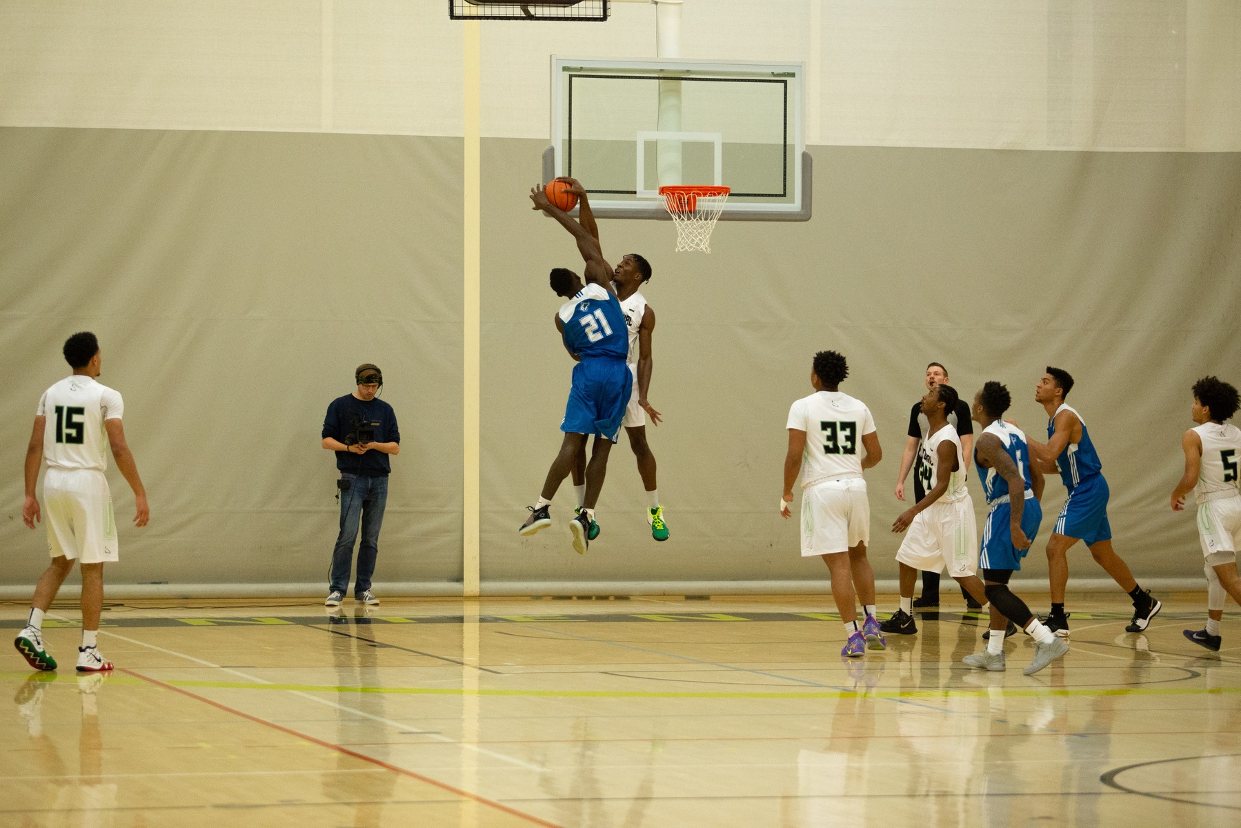 Edose Etomi blocks Kingslee D'Silva at the rim during first quarter action between the Centennial Colts and the George Brown Huskies. (Nicole Ventura/Colts Media)