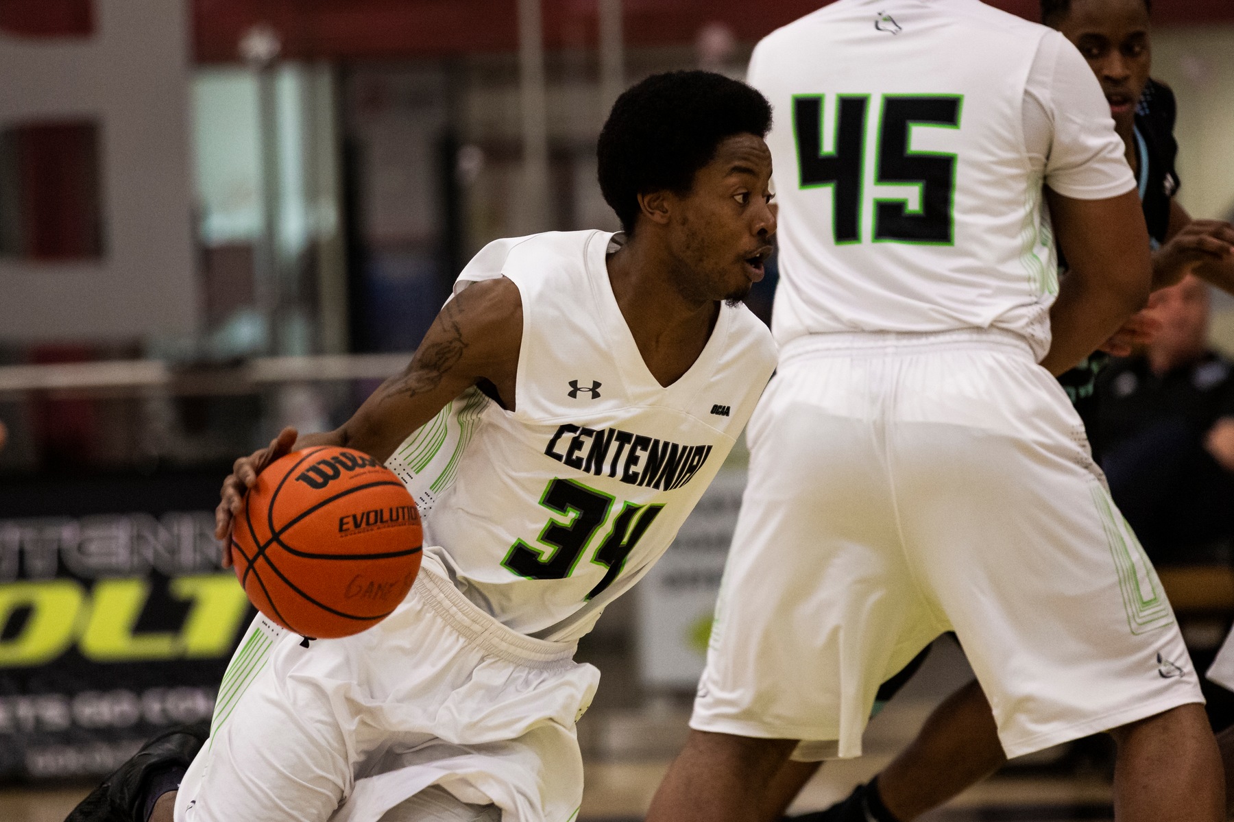 Ian Francis of the Centennial Colts uses the screen from Tristan Quarry and drives towards the middle of the lane during game action against the La Cite Coyotes at the AWC. Francis' effort led a Colts bench that scored 48 of the team's 85 points in the win. (John Theurer/Colts Media)