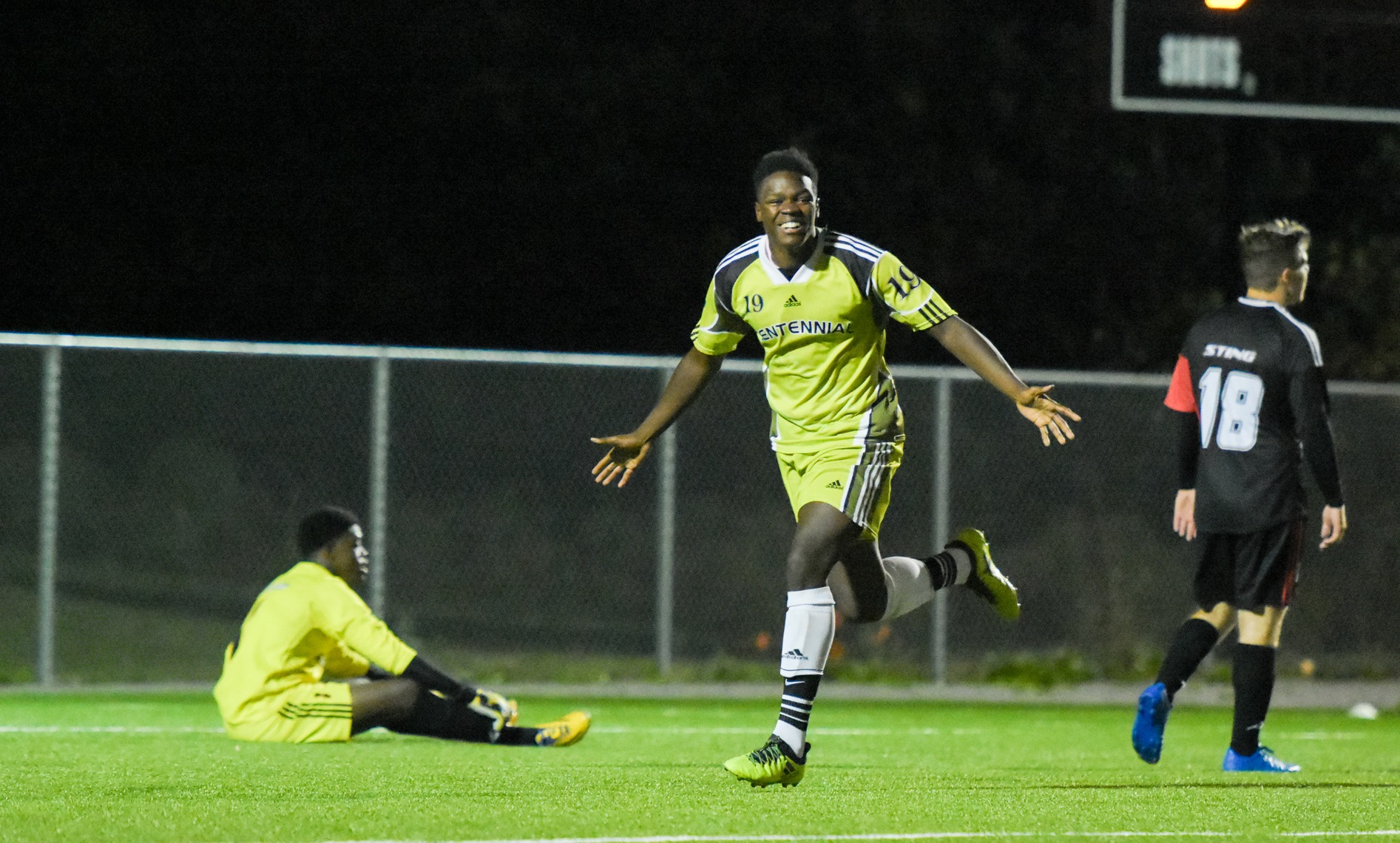Centennial Colts defender Kyle Cohall (centre) celebrates after scoring his first goal of the season as Seneca Sting goalkeeper Tayjion Campbell (left) and midfielder Peter Papadopulos (right) look away in second half action at AWC Colts Pitch. The Colts clinched a playoff spot by beating Seneca, 4-0.