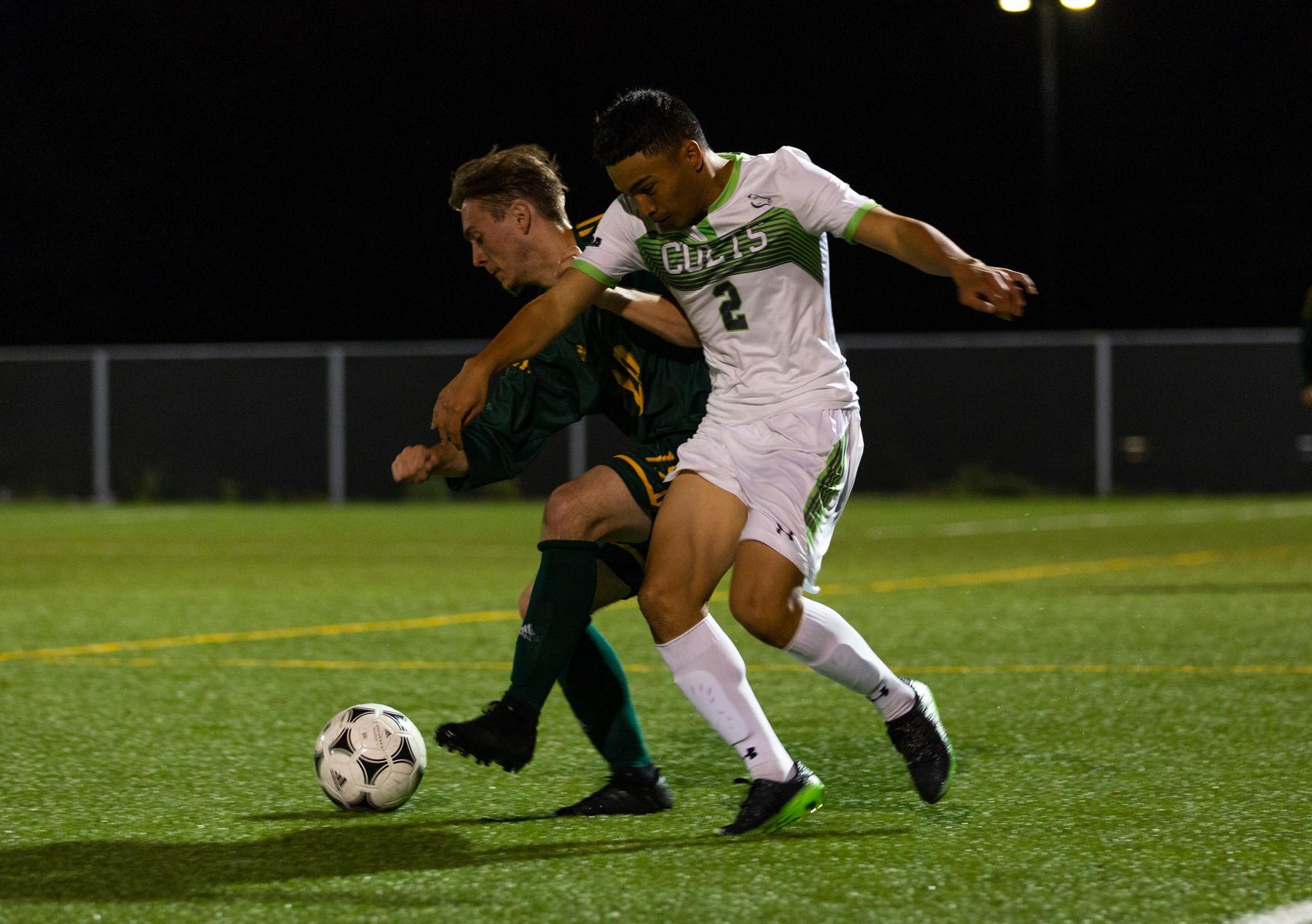Centennial's Adrian Bojaca-Tolentino and Durham's Nate Paine fight for the ball during Tuesday night's action between the top two teams in the OCAA East. Durham's three first half goals were ultimately too much to overcome for Centennial as they fell, 4-1, at Progress Turf Field. (John Theurer/Colts Media) 