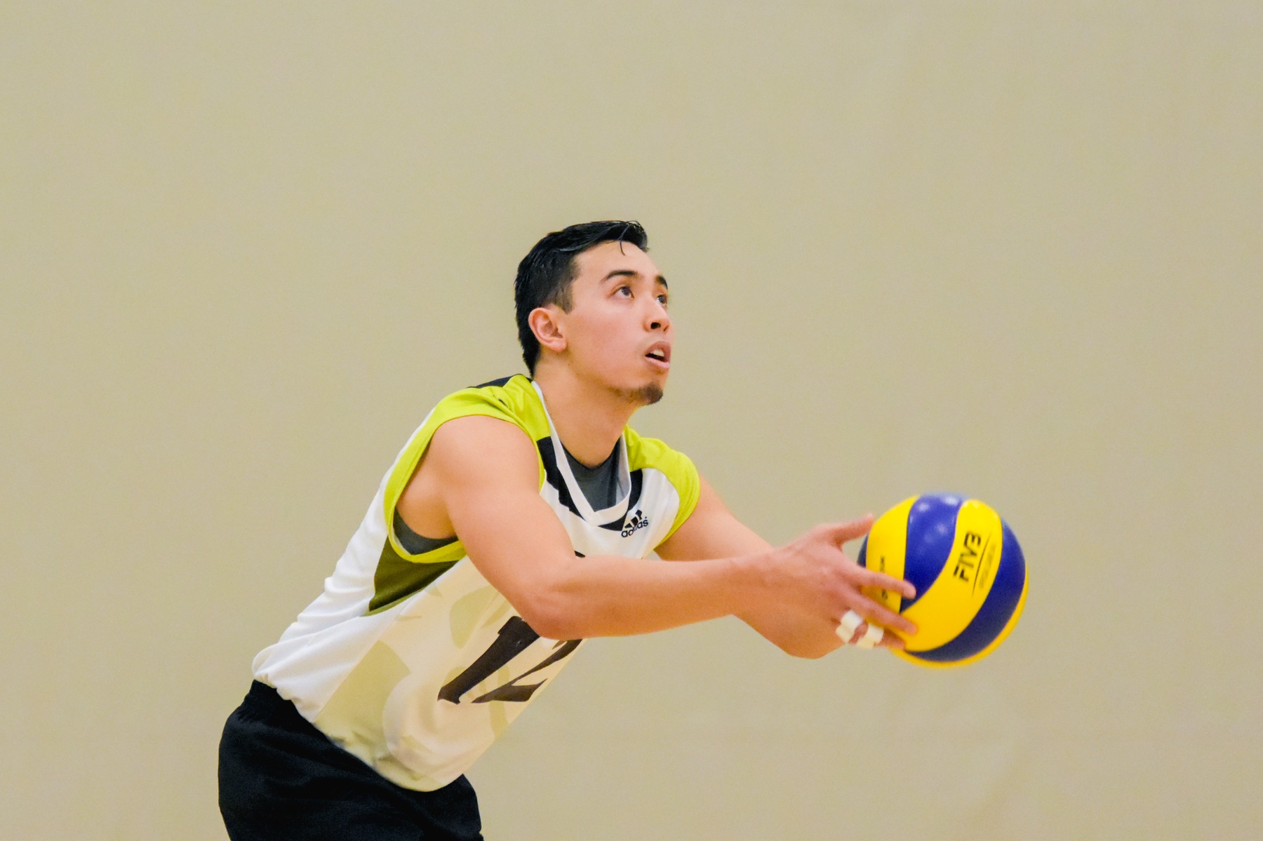 Colts men's volleyball player Sev Libramonte gets ready to serve the ball.