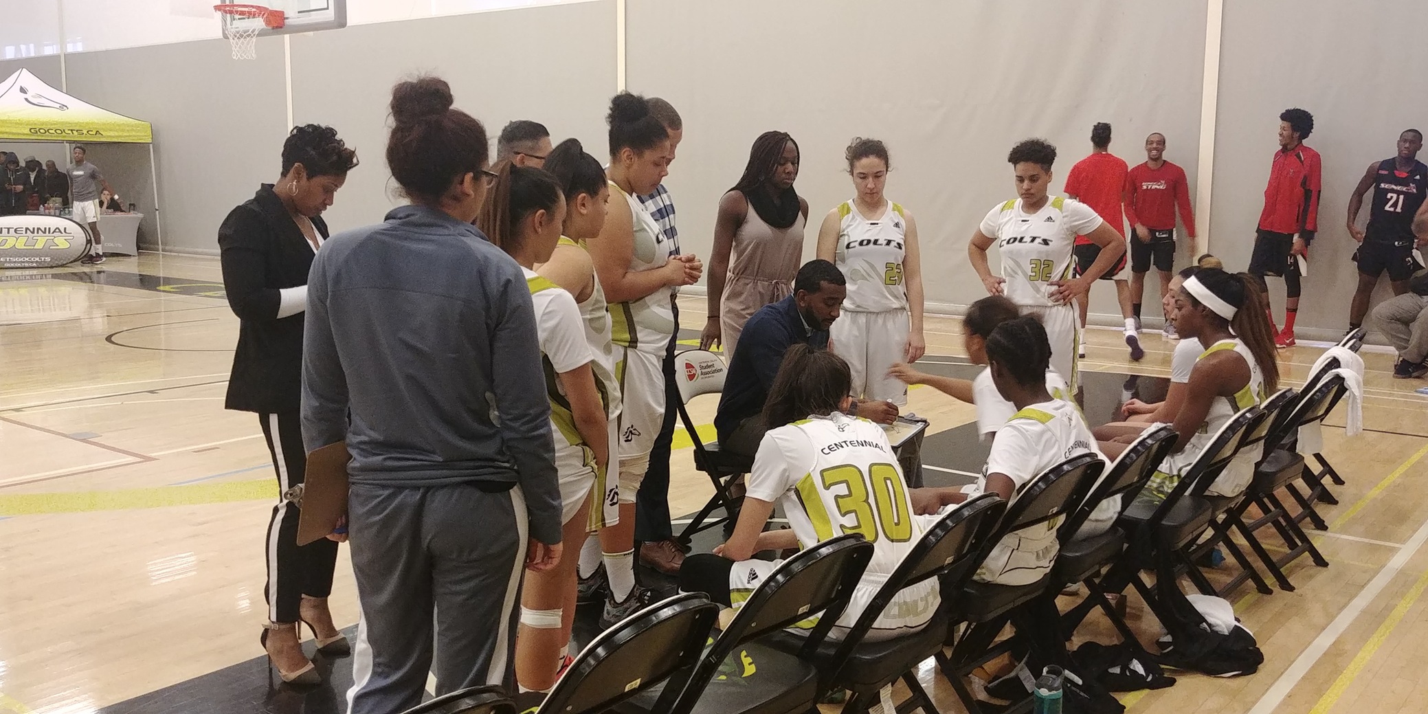 Centennial Colts head coach Justin Bobb draws up a play for his players during a timeout in the fourth quarter against the Seneca Sting. Despite having Seneca on the ropes for most of the game, Centennial ultimately fell short, losing 62-53.