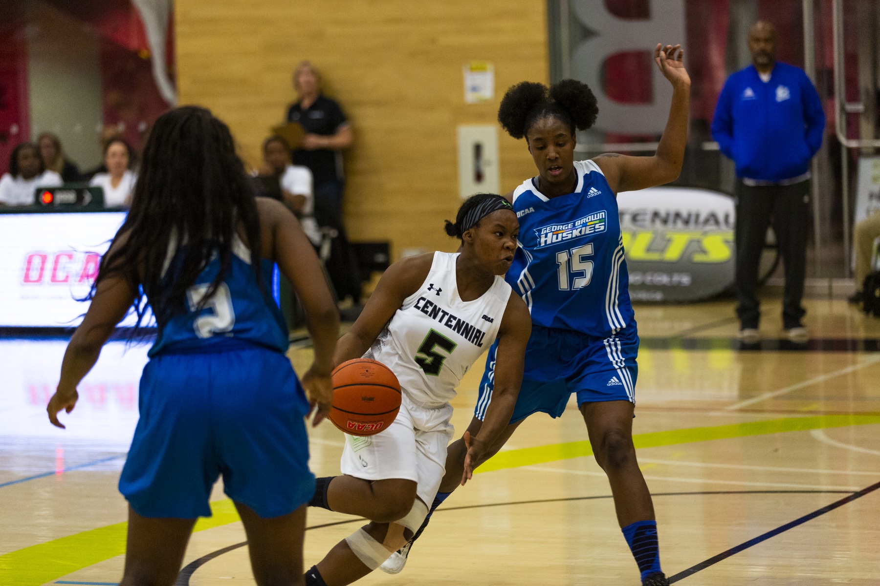 MaryAnn Blake of the Colts drives past Tianna Sullivan of the Huskies during first half action of Saturday night's game between the two rivals. (John Theurer/Colts Media)